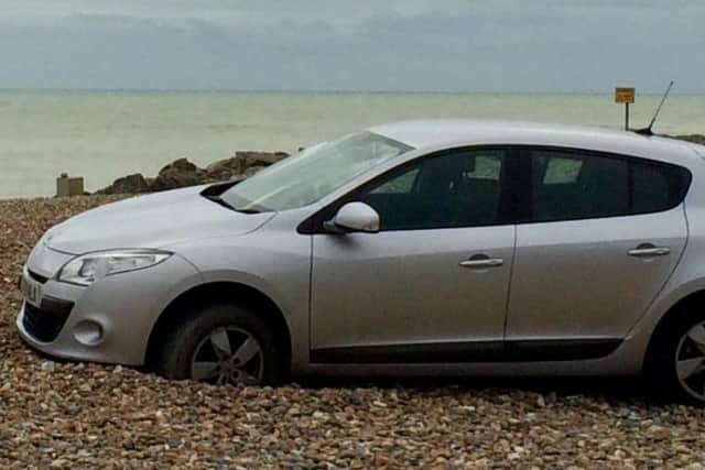 A car was left stranded on Worthing beach
