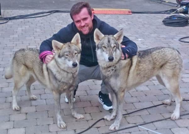 Actor Jonas Armstrong with two of the Watermill Wolves on the Ripper Street set in Ireland SUS-160510-155608001
