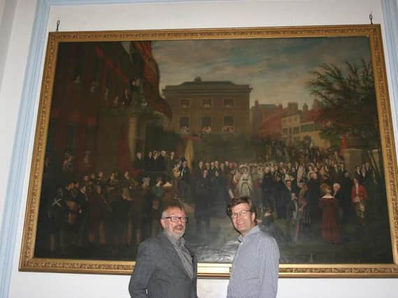 Dr Mike Turner and Rupert Featherstone pictured in front of 'The Visit'