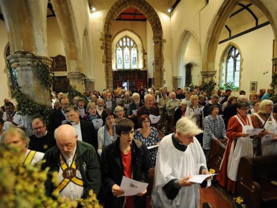 Churchgoers pack into St Thomas a Becket for the Harvey's Harvest service