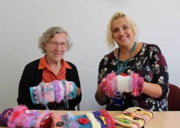 Aurora (left) is St Barnabas House's dementia lead nurse who is developing services to become more dementia friendly, while Margaret (right) is a volunteer who knits 'twiddlemuffs'