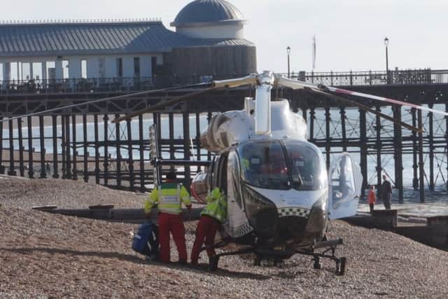 The air ambulance on the beach after a cyclist fell and seriously injured his head. Photo by Dave Johnson SUS-160310-164558001