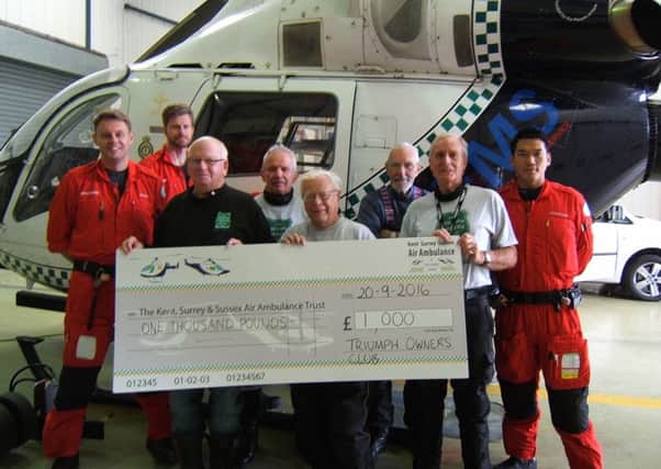 Triumph Motor Cycle Owners Club West Sussex Branch presenting a cheque for Â£1,000 to Kent Surrey and Sussex Air Ambulance