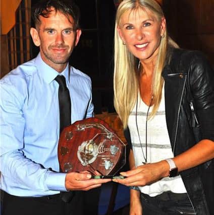 Ben Horley (left) collects his unsung hero of the year award from Sharron Davies. Picture: Stephen Goodger