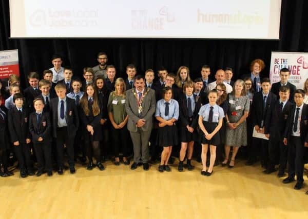 Bexhill Academy students, teachers, mayor Simon Elford, and representatives from Hastings Direct, LoveLocalJobs.com and humanutopia at the Be the Change graduation. Photo courtesy of Hastings Direct SUS-160510-094326001