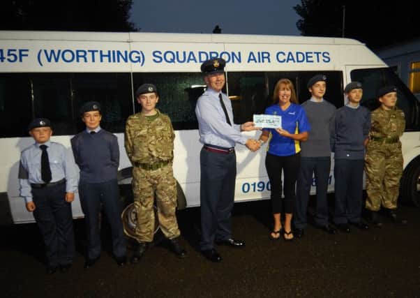Air cadets receive donation from runner Nuala Smyth