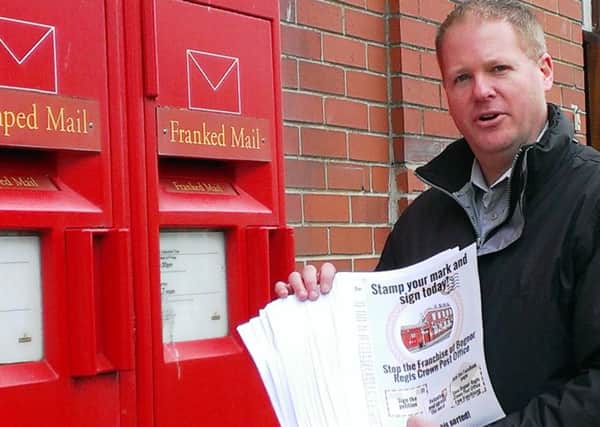 Paul Wells with some of the petition sheets opposing plans to franchise Bognor Regis Post Office SUS-160217-112711001
