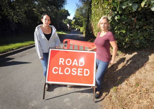 L-R Sisters Samantha Bevan and Vicky Wickham-Robinson pictured in Three Oaks. SUS-160510-124147001