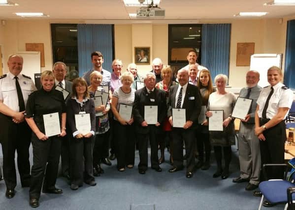 volunteers at Southwater Police station receive their certificates