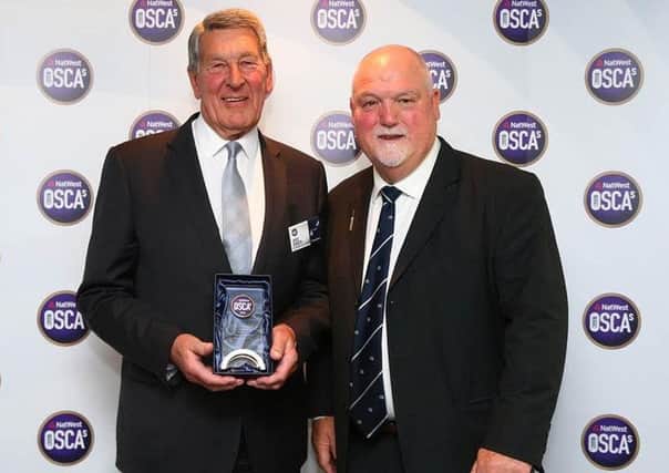 David Bowden (left) receives his lifetime achiever award from former England captain Mike Gatting
