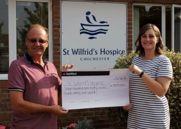 Salthill's Andy Beal presents the cheque to Jasmine Barton of St Wilfrid's Hospice