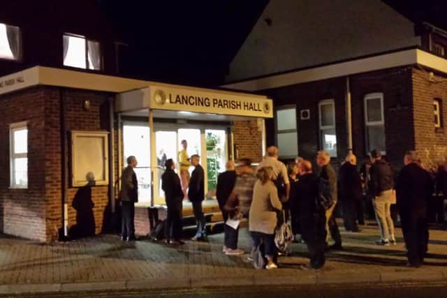 Councillors, members of the public, and one cold reporter waited outside until the alarm stopped