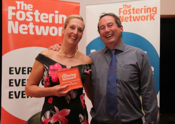 Deborah Waygood, who received the Fostering Community Supporter award at The Fostering Networks Fostering Excellence Awards, with her partner Mark Jackson SUS-160710-153341001