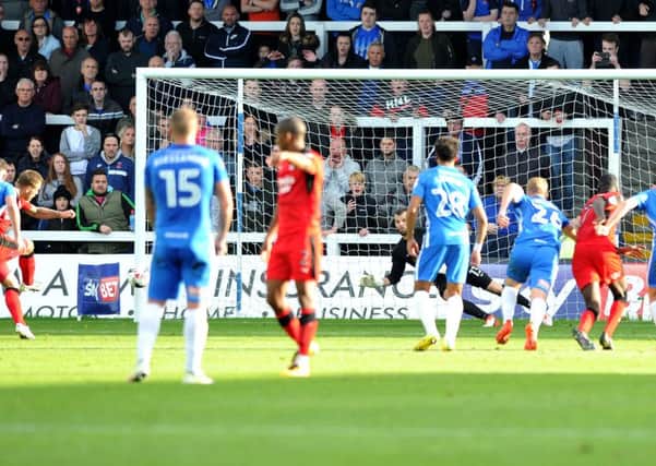 James Collins slots in Crawley Town's equaliser from the penalty spot at Hartlepool