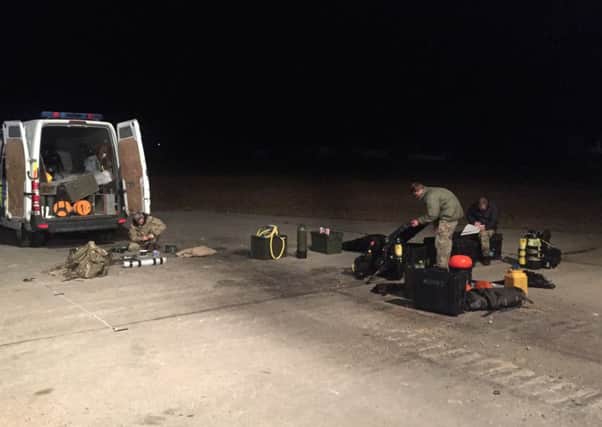 Navys Bomb Disposal Team setting up their kit at Hastings Lifeboat Station.