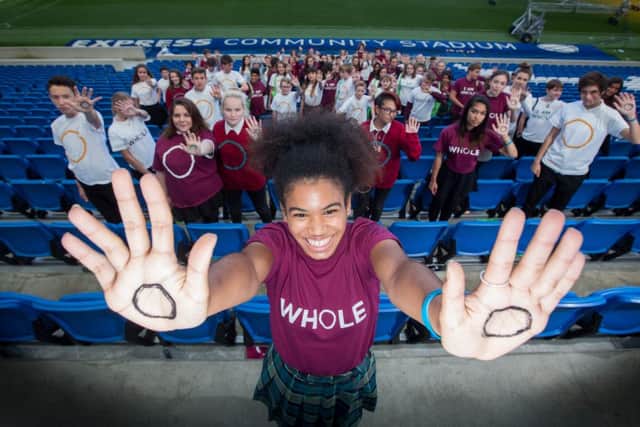 I AM WHOLE NHS Campaign - Students from secondary schools and colleges from the county, as well as members of Brighton & Hove  Youth Council, gather at the AMEX Stadium in support of the campaign SUS-160710-130555001