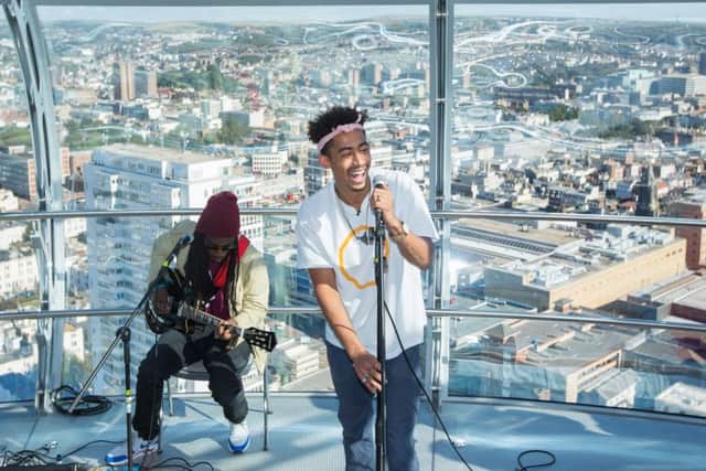 Jordan Stephens from Rizzle Kicks performs track "Whole" at the top of the i360 in Brighton to launch new NHS and YMCA anti-stigma Mental Health campaign #IAMWHOLE for World Mental Health Day (Photograph: Ciaran McCrickard Photography) SUS-160710-130620001