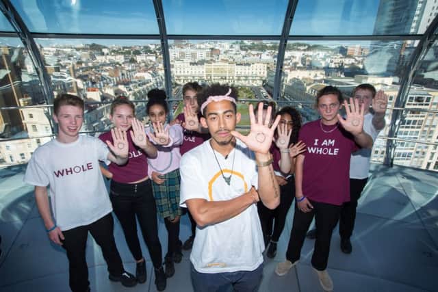 Jordan Stephens from Rizzle Kicks performs track "Whole" at the top of the i360 in Brighton to launch new NHS and YMCA anti-stigma Mental Health campaign #IAMWHOLE for World Mental Health Day (Photograph: Ciaran McCrickard Photography) SUS-160710-130633001