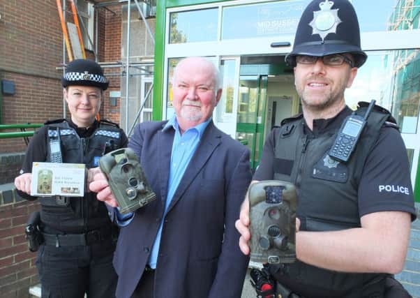 PC Sarah MackNamara, Councillor Norman Webster and PC Anthony Bentham with new CCTV cameras SUS-161110-132255001