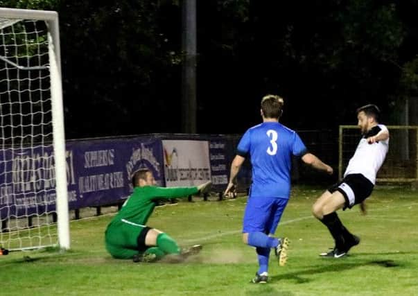 Goalmouth action as Pagham host Midhurst / Picture by Roger Smith