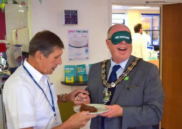 Bognor Regis mayor Pat Dillon, left, gives Arun District Council chairman Stephen Haymes a cake taste test