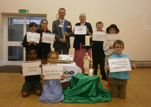 Sacred Heart Primary School, Hastings, welcomed aid agency CAFOD volunteer Anne Barry who ran a special assembly to teach the pupils about the lives of refugees. SUS-161210-102339001