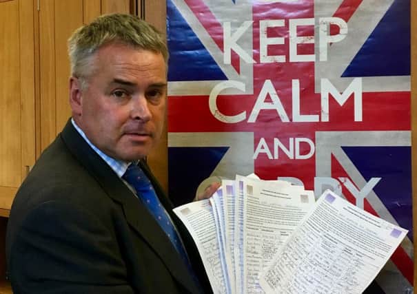 East Worthing and Shoreham MP Tim Loughton presented signatures to the House of Commons calling for transitional relief for women born in the 1950s affected by changes to the state pension age (photo submitted). SUS-161210-103600001