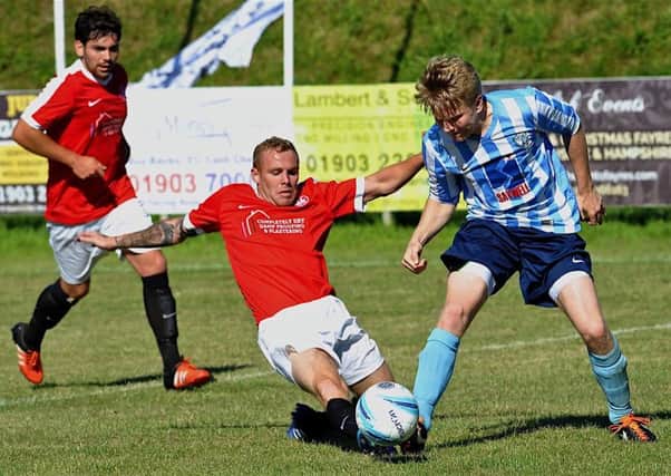Matt Hards struck from the penalty spot twice as Worthing United progressed in the Peter Bentley Cup last night. Picture: Stephen Goodger