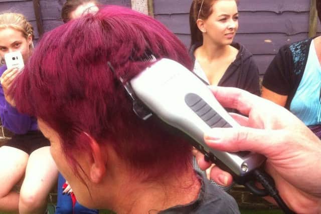 Karen Hill, 46, from Worthing, shaved her head to raise money in memory of her friend Jo Hammond, who died of pancreatic cancer aged 50