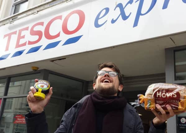 Herald reporter James Butler bemoans the potential loss of Marmite from Tesco's shelves - the 'perfect partner' to a slice of bread. Pictured outside the Tesco Express store in Chapel Road, Worthing