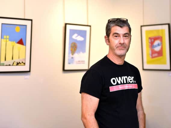 Charlie Dobres with the Lewes FC posters