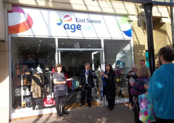 Deputy Mayor of Hastings, Councillor Nigel Sinden, cuts the ribbon to officially open the new Age UK East Sussex charity shop in Hastings. SUS-161018-103222001