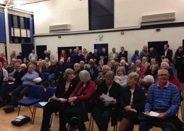 Residents packed into the village hall in Storrington to discuss the Glebe Fields planning application SUS-161014-105547001