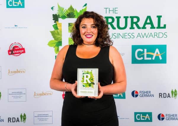 Caroline Lindsay, owner of The Naked Food Company, with her award