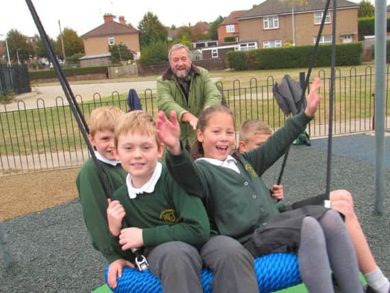 Opening of refurbished play area in St George's Road, Bexhill. Children from Chantry Community Primary School with Cllr Jonathan Johnson, Rother District Council cabinet member for young people, sport and leisure SUS-161017-100438001