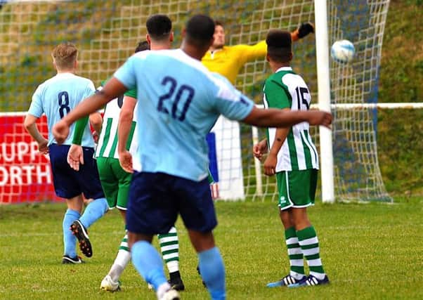 Chamal Fenelon scores with an excellent free kick against Chichester on Saturday