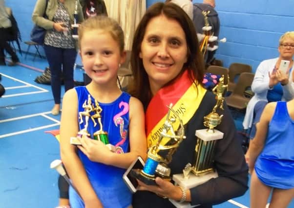 Star Twirler award winner Freya Waters (8)  took first prize in a Charity Majorette completion in aid of Breast and Pancreatic Cancer in Aldershot. Pictured with her mum Clare who was a baton twirler for the Crawley Dazzlers - picture submitted