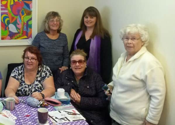 Craft & Hobbies owner Sarah McLauchlan (back, middle) with some of the ladies from the cross stitch and natter group