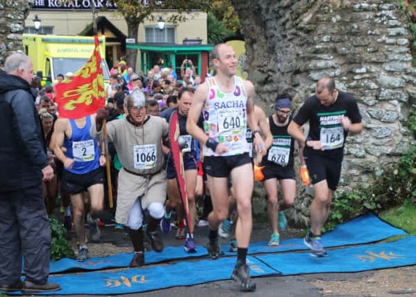 Runners set off from Pevensey Castle at the start of the race. Picture courtesy Alan Roberts