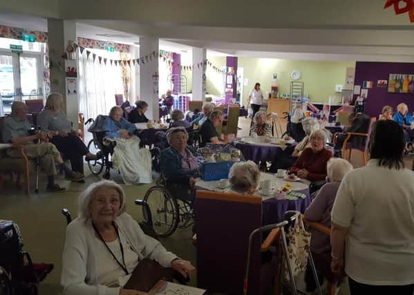 Residents, staff and visitors hold a coffee morning at Marriott House