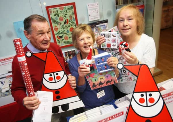 Cards for Good Causes opens its Christmas shop, from left, Shaun Coppard, Judith Price and Chris Robinson. Picture: Derek Martin DM16149221a