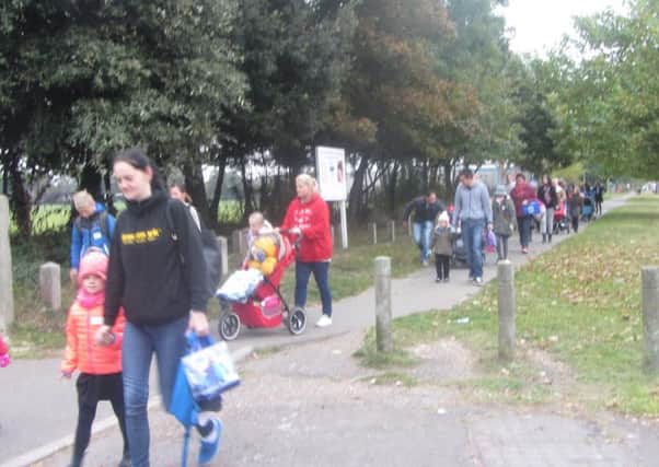 About 50 parents and children took part in the walk