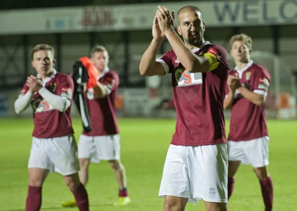 The Rocks players, in their new away kit, applaud the fans - led by scorer Sami El-Abd / Picture by Tommy McMillan