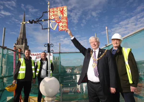 DM16149632a.jpg. The weathervane is put back on top of the Chichester Cross. L to R Peter Roberts, Phil Rowley, Mayor Cllr Peter Budge and Ian Harris who painted it.  Photo by Derek Martin SUS-161019-132731008