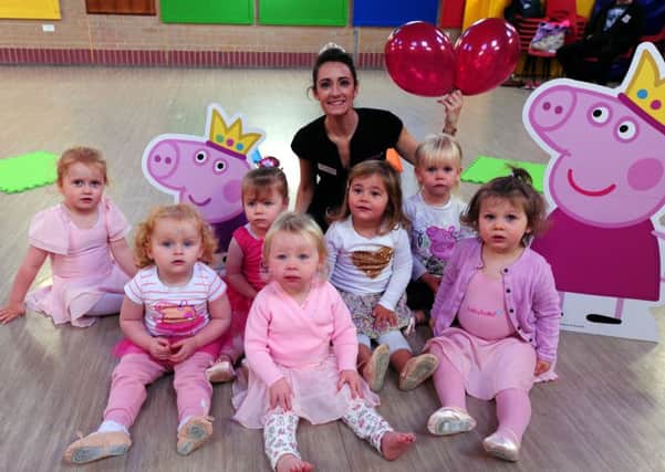 Baby ballerinas pose with Peppa Pig and George at Felpham Methodist Church hall on Saturday. Pictures: Kate Shemilt ks16001136-4