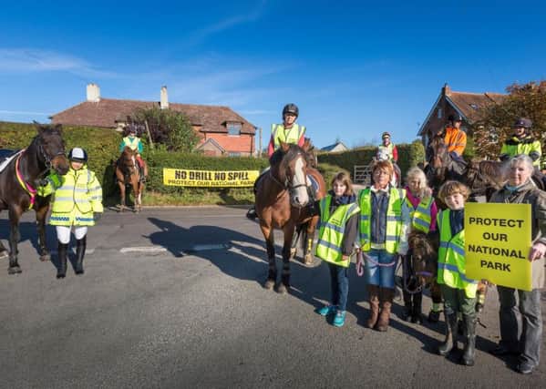 Horse riders demonstrate at Forestside to illustrate the dangers for people on part of the route that would be taken by lorries and tankers if an oil production development is approved at Markwells Wood. Photo by Christopher Ison