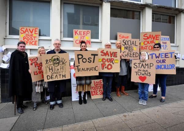 The protest outside the post office in London Road, St Leonards. SUS-160511-145244001