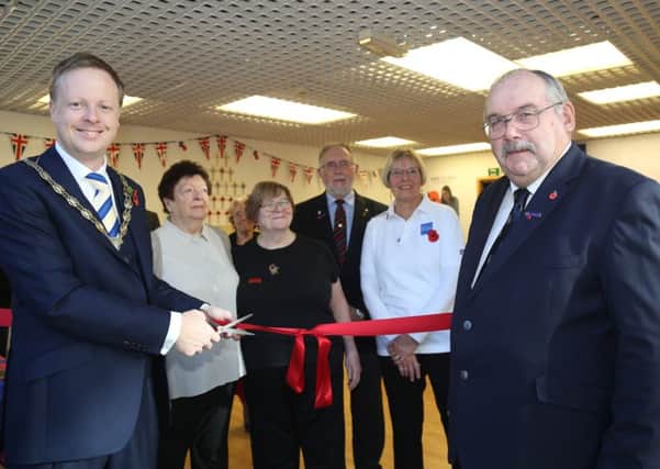 Horshams British Legion store is officially opened by Horsham District Council Chairman Cllr Christian Mitchell and Chairman of the Horsham branch of the Royal British Legion Nigel Caplin.
