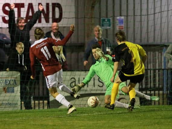Harry Stannard scores Hastings United's second goal in the 7-0 thrashing of Herne Bay on Tuesday night. Picture courtesy Scott White