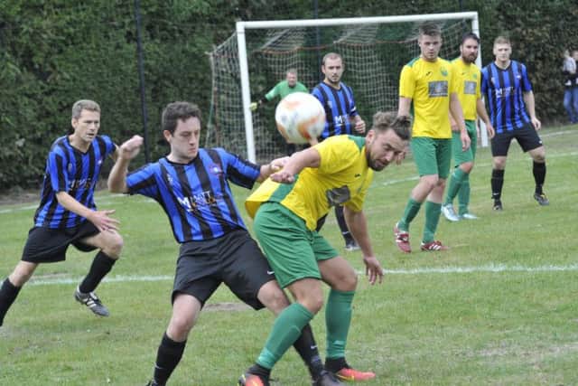 Callum Smith in the thick of the action for Westfield against Worthing Town Leisure last weekend. Picture by Simon Newstead